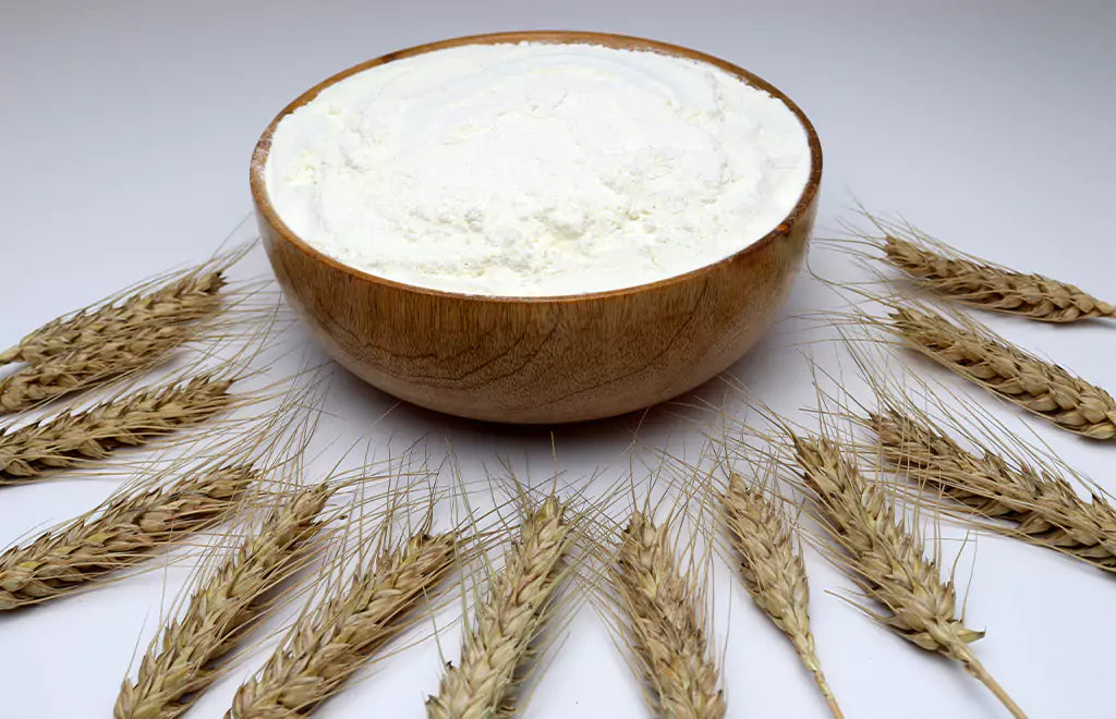 Rice Flour in a Bowl with Wheat Stalks