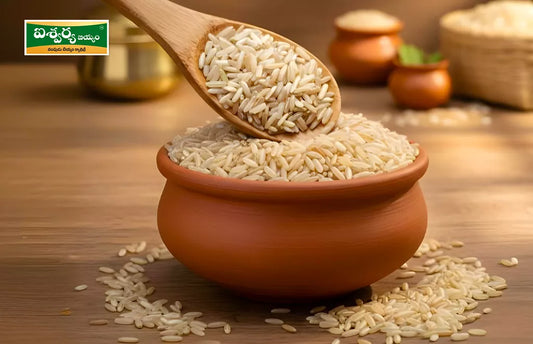 Aishwarya Rice in Wooden Spoon Over Clay Pot